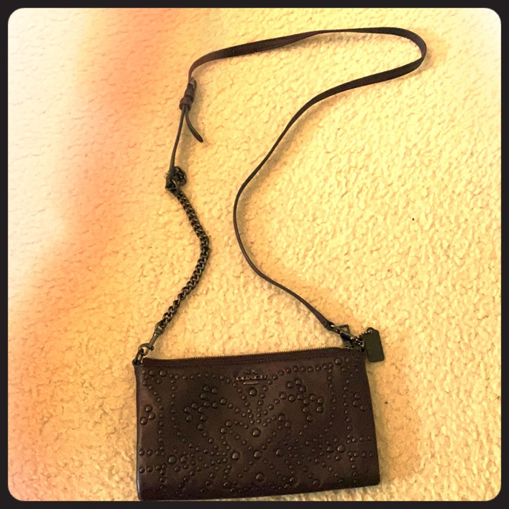 Coach Crossbody mini bag with riverts design.